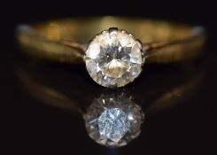 An 18ct gold ring set with a round cut diamond of approximately 0.66ct, 2.7g, size N