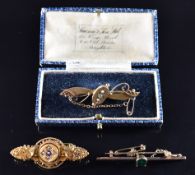 Edwardian 15ct gold brooch set with a ruby and old cut diamonds, verso a glass compartment (5.6g),