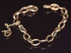 A 9ct gold section of watch chain made up of oval patterned links, 20cm, 9.3g