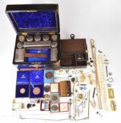 A collection of jewellery and medallions including Delft brooch, beads, bone necklace, glasses,