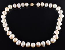 A single strand of freshwater pearls with 14k gold ridged clasp