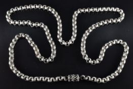 A c1900 silver necklace made up of oval textured links with floral clasp, length 115cm, 101g