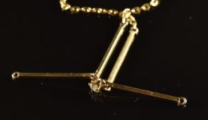 A 9ct gold necklace set with a diamond, 2.6g