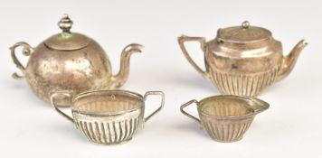 Novelty white metal miniature teaware comprising teapot and a three piece teaset, all marked 925,