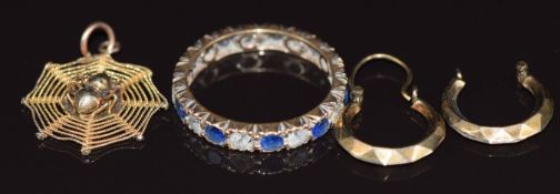 A 9ct gold eternity ring set with paste, 14k gold pendant in the form of a spider and web and 9ct