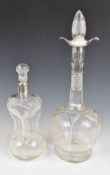 Two hallmarked silver mounted cut glass decanters, one being Sheffield 1915, maker Walker & Hall,
