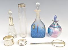 Two hallmarked silver napkin rings (weight 35g), two hallmarked silver mounted bottles, Julia