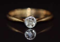 An 18ct gold ring set with an old cut diamond of approximately 0.25ct in a platinum setting, 1.8g,