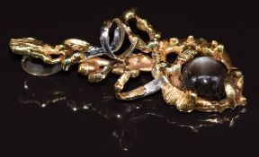 A 1970s 18ct bi-coloured gold pendant set with a quartz star cabochon, London 1973, maker SGC