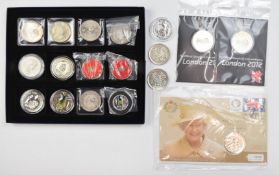 A collection of various £5 coins including military and Royal commemorative examples and Olympic