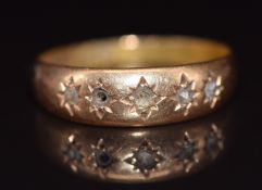 An 18ct gold ring set with rose cut diamonds
