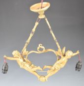 Gilt metal light fitting in the form of two cherubs, width 44cm