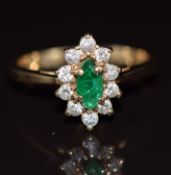 A 14k gold ring set with a marquise cut emerald surrounded by diamonds, 3.0g, size M
