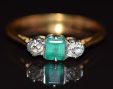 An 18ct gold ring set with an emerald and old cut diamonds in a platinum setting, 2.2g, size L