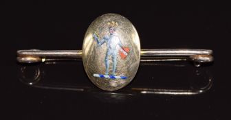 An 18ct & 9ct gold brooch set with enamel depicting a soldier, maker M & M, 5.3g