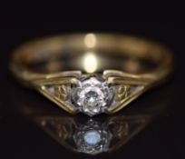 An 18ct gold ring set with a diamond in an illusion setting, 2.4g, size M