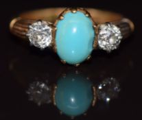 An 18ct gold ring set with a turquoise cabochon and two old cut diamonds, each approximately 0.25ct,