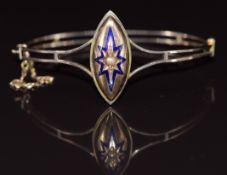 Victorian 9ct gold bangle with a marquise shaped gold cabochon set a blue enamel star and a seed