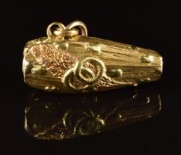 Victorian pendant / charm in the form of a coffin with embossed decoration depicting skull and