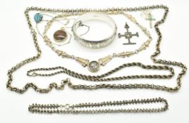 A silver bangle and six silver necklaces including rope twist, filigree, etc and a silver pendant by