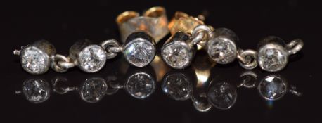 A pair of Victorian earrings each set with three old cut diamonds measuring approximately 0.12ct