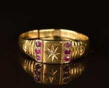 Edwardian 18ct gold ring set with a diamond and rubies, Chester 1902, 2.2g (band has been cut)
