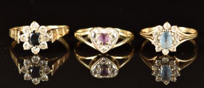 Three 9ct gold rings set with amethyst, sapphire and topaz, 5.2g, size M/N