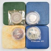 Four Royal Mint commemorative crowns including silver, in fitted cases, two with certificates