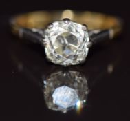 A c1920 18ct gold ring set with an old cushion cut diamond of approximately 1.2ct in a platinum