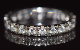 An 18ct gold eternity ring set with diamonds, 3.2g, size L