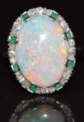 Art Deco platinum ring set with an opal cabochon surrounded by old and rose cut diamonds and