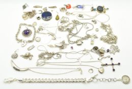 Twenty six silver pendants / chains including pressed amber, amethyst, lockets, etc and three silver