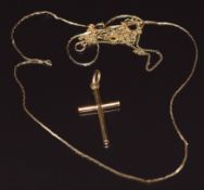 An 18k gold cross pendant (1.5g) and two 14k gold chains, 2.2g