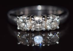A platinum ring set with three round cut diamonds, each approximately 0.35ct, 6.8g, size J