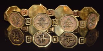 Chinese 14k gold bracelet made up of eight octangonal panels depicting Chinese characters, 26.8g