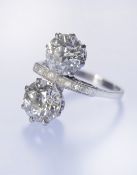 Art Deco platinum ring set with two transitional cut diamonds of approximately 2.1ct and 2ct and