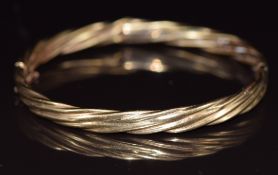 A 9ct gold bangle in a rope twist design, 8.6g