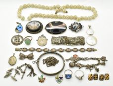 A collection of silver jewellery including bangle, two rings, T bar and tassel, St Christopher,