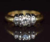 An 18ct gold bi-coloured ring set with a diamond of approximately 0.2ct, 6g, size L