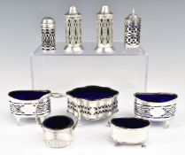 Four Victorian and later hallmarked silver salts with blue glass liners, similar example with loop
