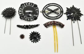 Six pieces of French jet including four hair slides / pins, a pendant and brooch
