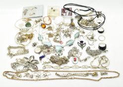 A collection of silver jewellery including eight rings, three bangles, six bracelets, thirteen