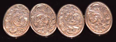 A pair of Edwardian 9ct rose gold cufflinks with scrolling decoration, Birmingham 1908, 7.7g