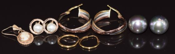 Three pairs of 9ct gold earrings, one pair set with a pearl to each, a single 9ct gold earring set