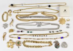 A collection of jewellery including Trifari necklace, Monet necklaces, Swarovski ring and brooch,
