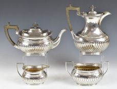 Elkington & Co Ltd, George V hallmarked silver four piece teaset with gadrooned edges and reeded