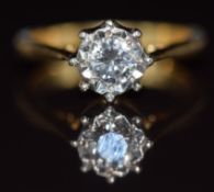 An 18ct gold ring set with a round cut diamond of approximately 0.3ct in an illusion setting, 3.3,