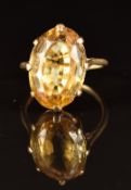 A 9ct gold ring set with an oval cut citrine, 3.6g, size M