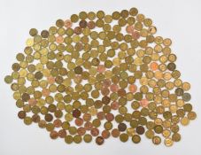 A large collection of brass threepenny bits