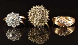 A 9ct gold ring set with diamonds and two 9ct gold rings set with cubic zirconia, 10.7g